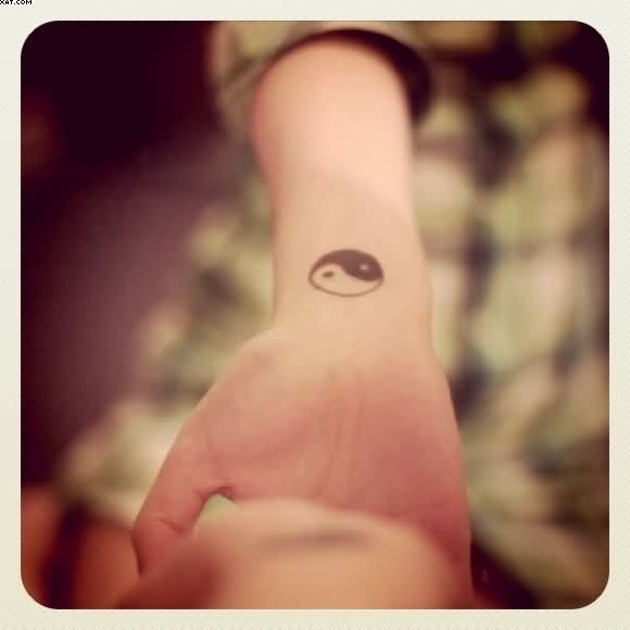 Small Yin Tattoo On Wrist