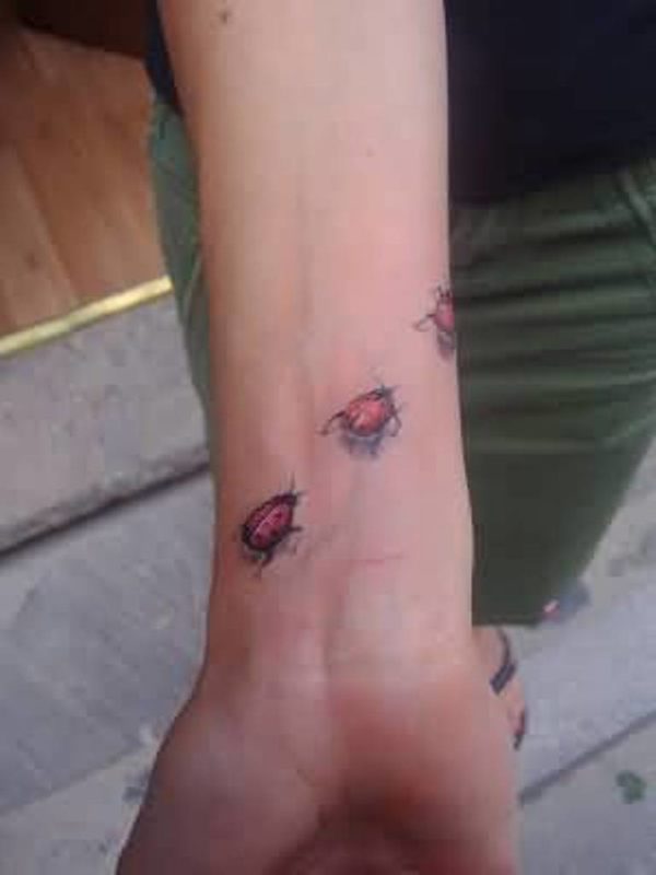 Three Ladybird Wrist Tattoo
