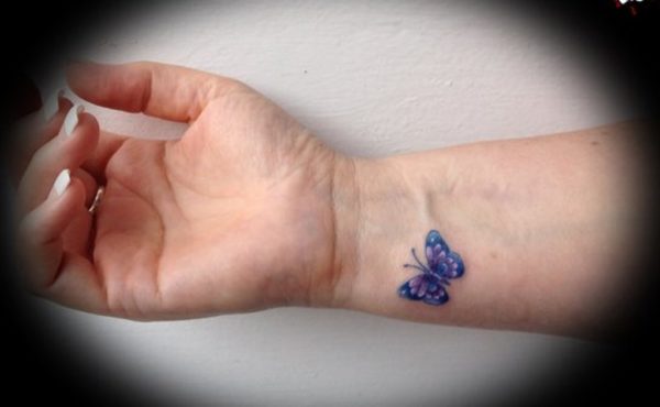 Tiny Blue Butterfly Tattoo On Wrist