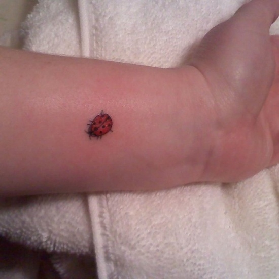 Tiny Ladybug Wrist Tattoo