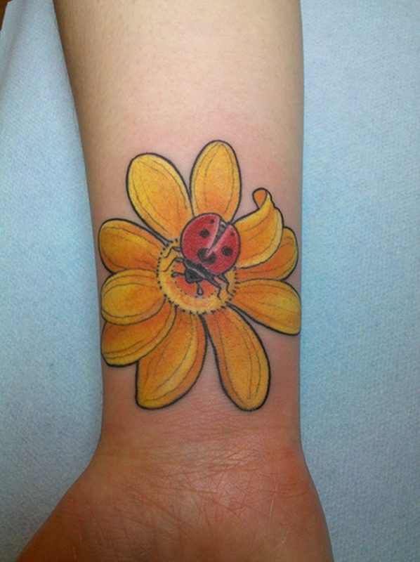 Yellow Flower Tattoo On Wrist