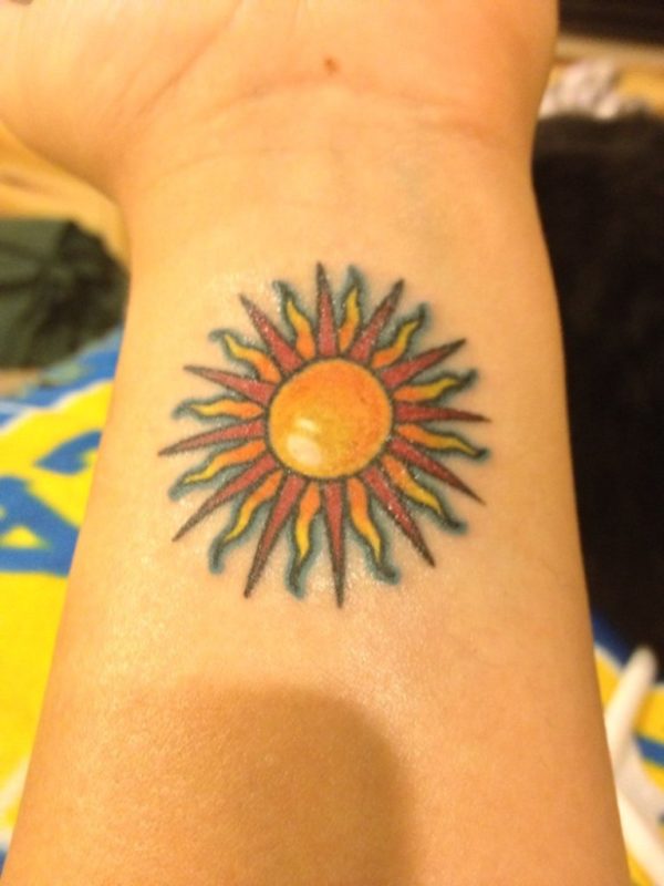 Yellow Sun Tattoo On Wrist