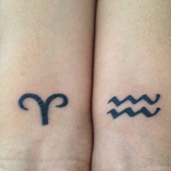 Black Aries And Cute Aquarius Tattoo On Wrist