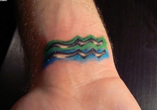 Blue And Green Aquarius Wrist Tattoo