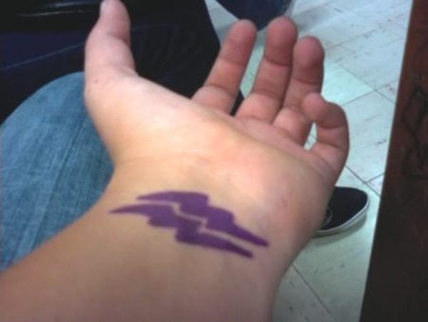 Purple Aquarius Tattoo On Wrist