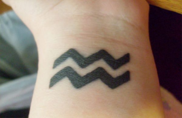 Wonderful Aquarius Tattoo On Wrist